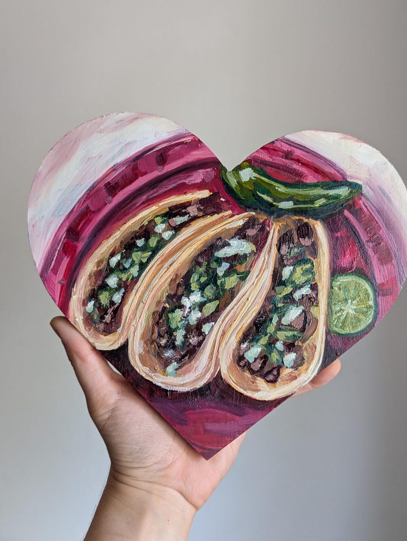 Summer Lunch, Krista's heart-shaped pink oil painting of tacos, lime, and a chili pepper
